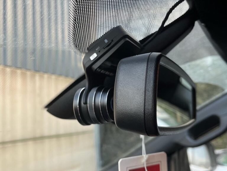 Dashcam installed behind the rear view mirror of a Sandbach vehicle