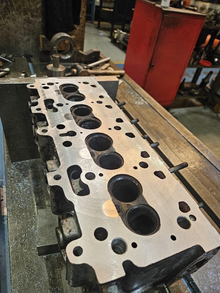 Cylinder head on the bench from a booked in engine job for a New Mills customer