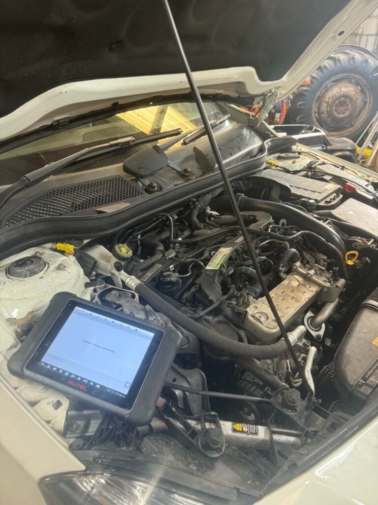 Diagnostic scan tool in use on a vehicle in Macclesfield