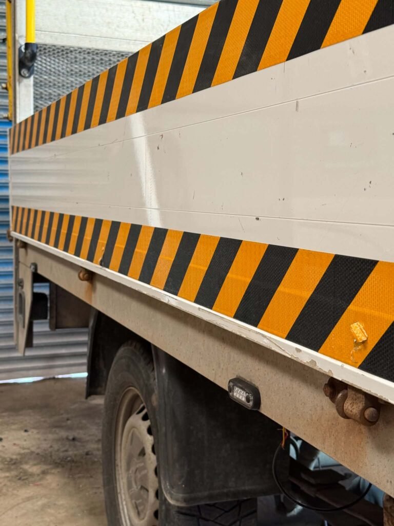 Chevron markings and marker lights fitted to a flatbed working near Nantwich
