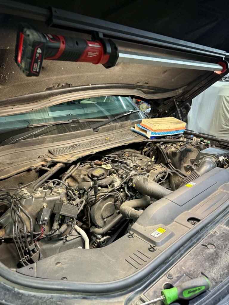 Bonnet up at the start of a repair on a car in Macclesfield